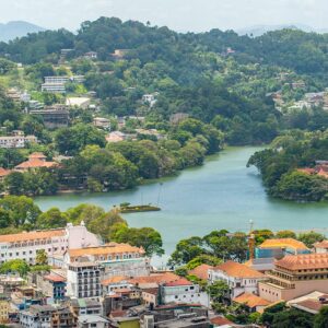 A sky view of the lush greenery, lake and the ancient buildings of the charming city of Kandy, the Capital of Central Highlands in Sri Lanka