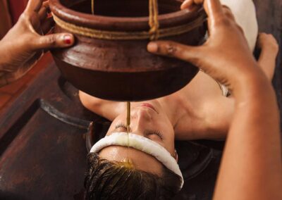 A Foreign lady experiencing an Ayurvedic Treatment at an Ayurvedic Spa