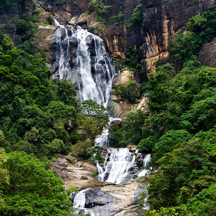The Beautiful Ravana Falls in Ella cascades over the rocky terrains amidst the verdant surroundings.