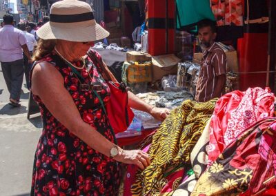 A foreign lady selecting materials at a Shopping stall at a Colombo Street