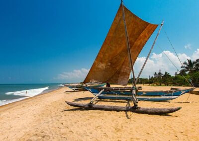 A Boat with a Yacht Sail at the Shores of Negombo
