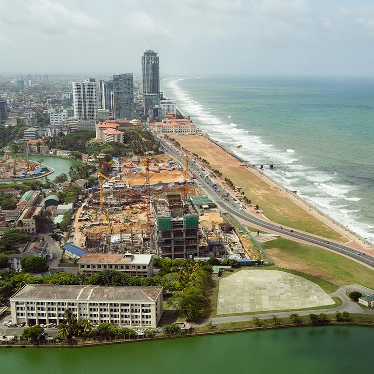 An aerial view of the galle face, with the sea, and the greenery around