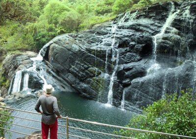 A foreigner staring at a wonderful waterfall at Horton Plains