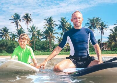 A father and a son trying Water Sports in Sri Lanka