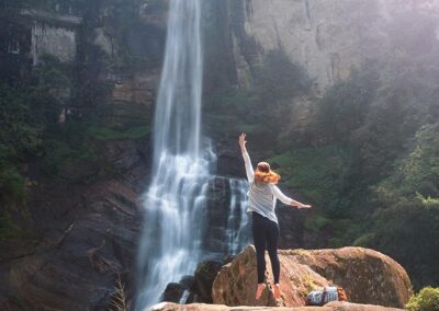 A young foreign girl Enjoying the Ramboda Falls