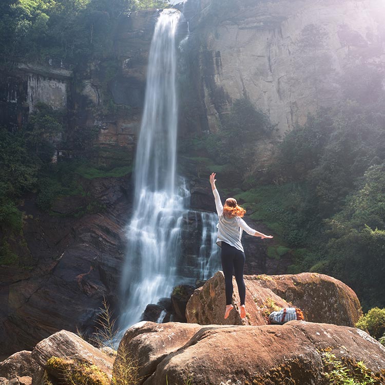 A young foreign girl Enjoying the Ramboda Falls