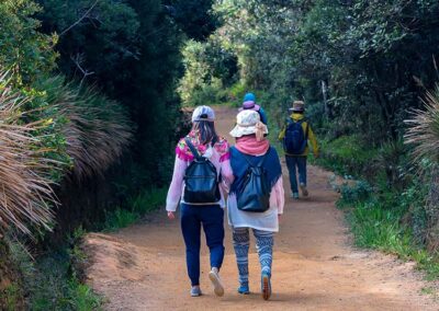 Tourists with backpacks walking along the paths at the Horton Plains