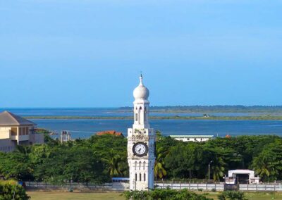 Jaffna Clock tower with the ocean in the back, and the verdant surrounding
