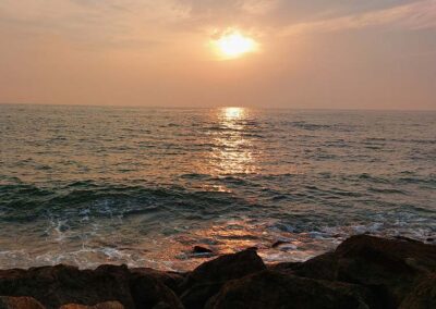 The beach, ocean, and the sun going down at the Negombo shores