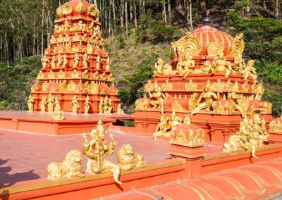The red and golden statues at the Seetha Amman Hindu Temple