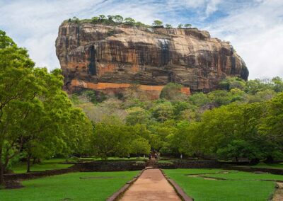 The Sigiriya rock fortress standing amidst the greenery