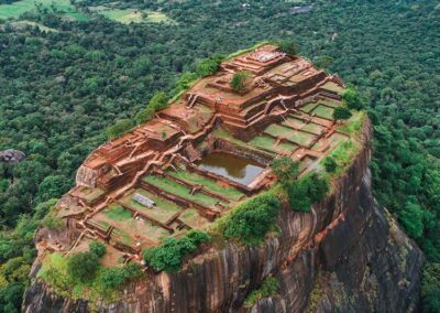 The Ruins of the ancient kingdom at the top of the Sigiriya Rock Fortress, along with the greenery that surrounds it