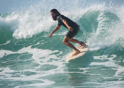 A foreigner surfing amidst the waves at Mirissa