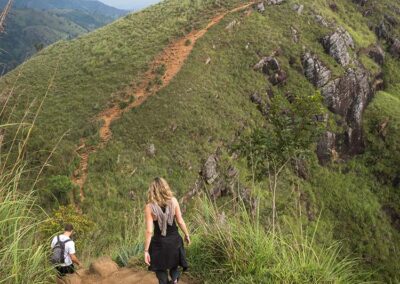 A man and a woman trekking Adam's Peak