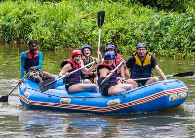 A team of foreigners white water rafting at Kitulgala